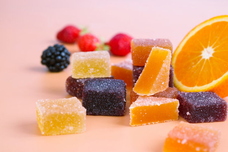 A colorful variety traditional French fruit jellies with fresh v